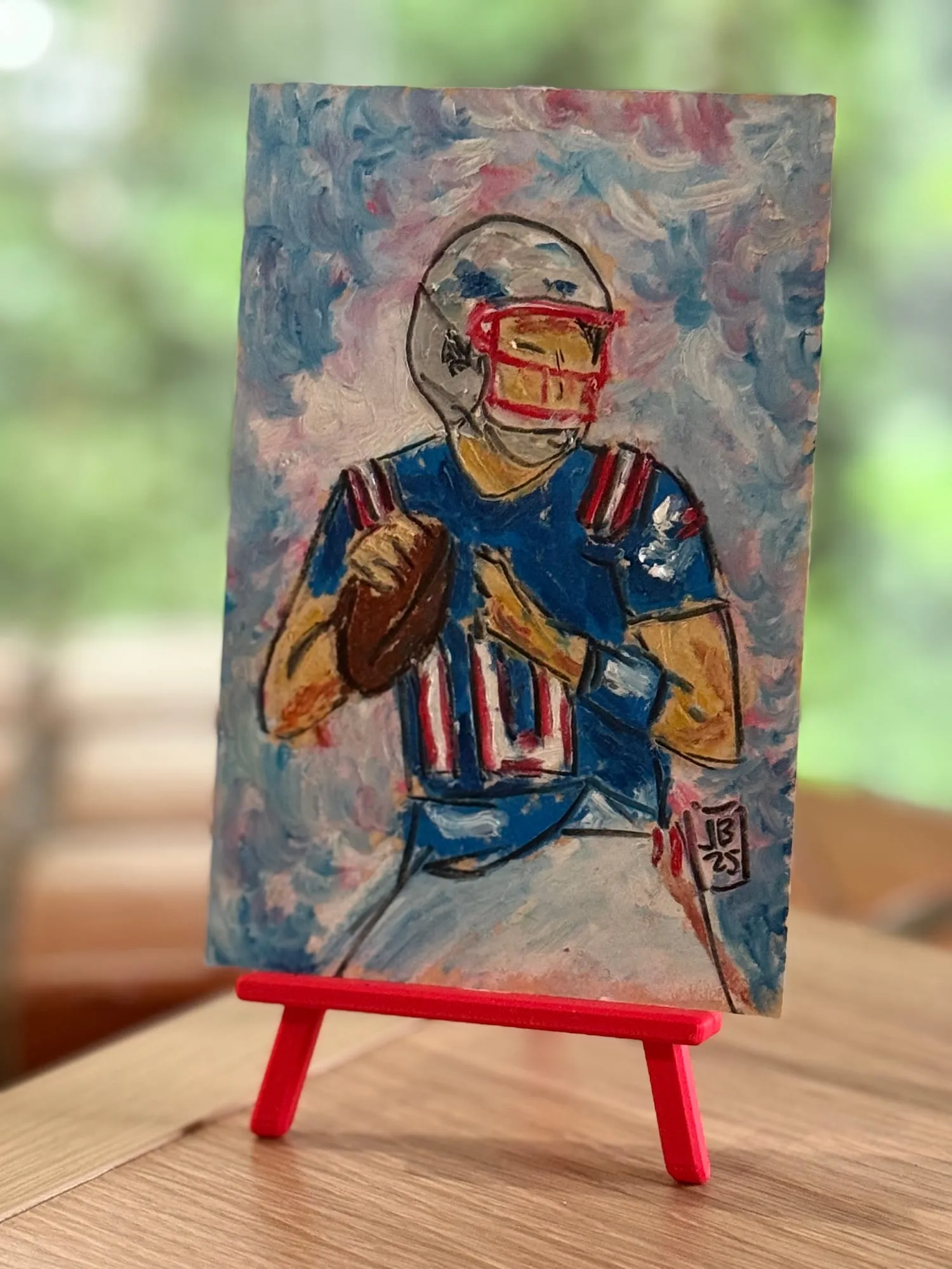 El quarterback — la pieza en el caballete del estudio